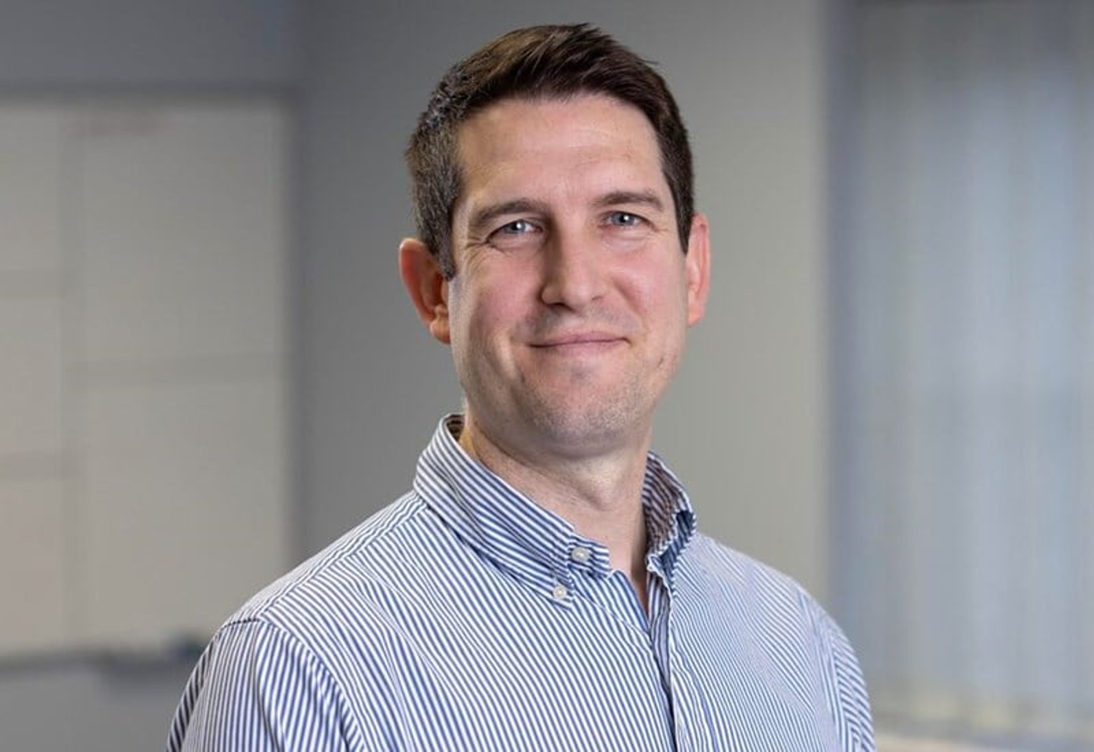 A headshot of Jon Shepheard